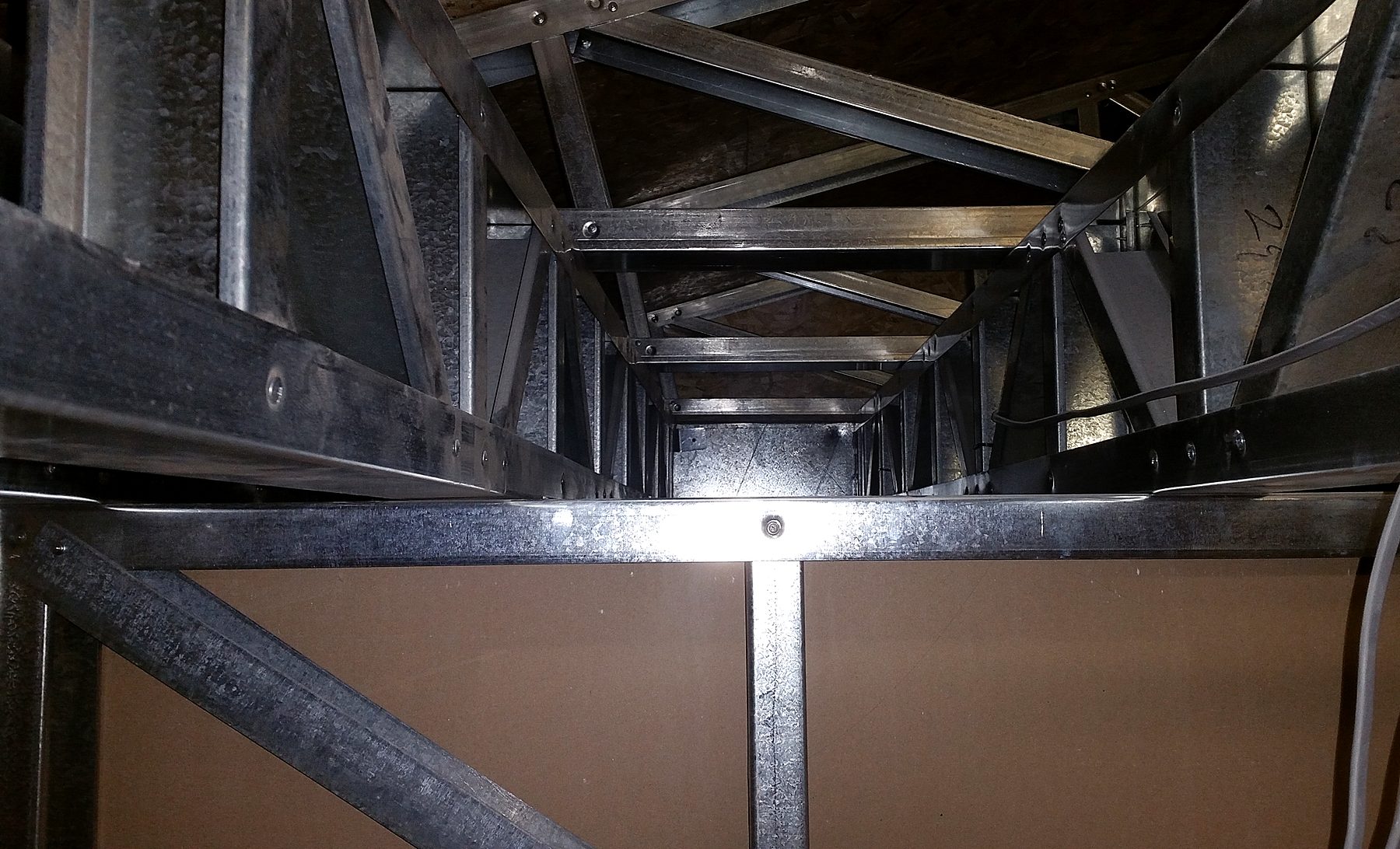 Light gauge steel joists and trusses above stud wall panels